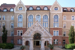 università